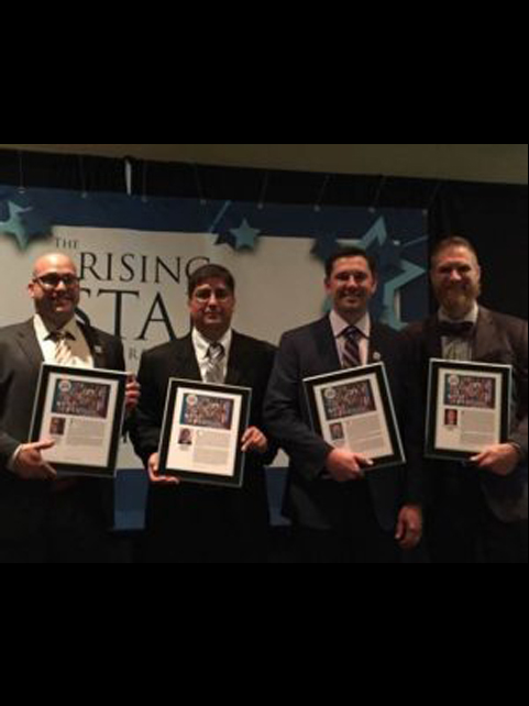 Patrick Kelly (far right) receiving 40 under 40 award along with a few other colleagues.